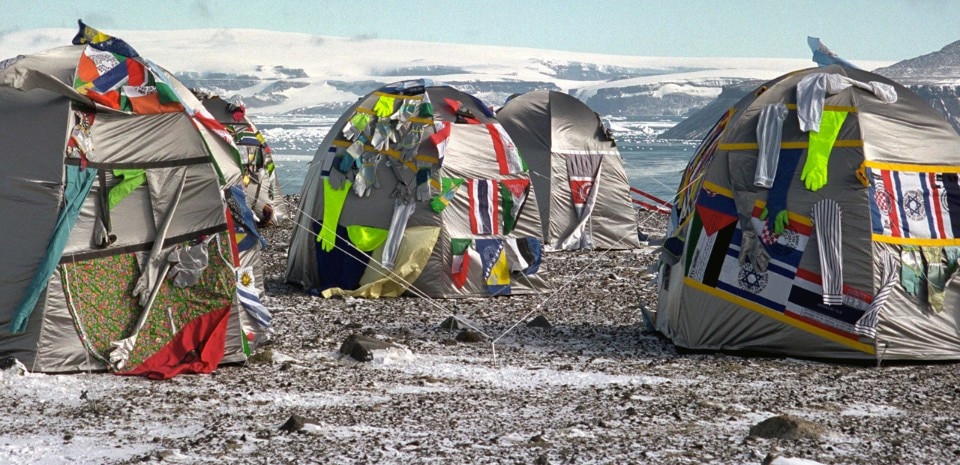 Lucy + Jorge Orta, <i>Antarctic Village - No Borders, Dome Dwelling</i>, 2007, ephemeral installation in Antarctica, 2007. 50 original dome dwellings, hand-stitched with nation flags, fragments of clothing, webbing, silkscreen print, dimensions variable. Courtesy of the artists. Photo: Thierry Bal