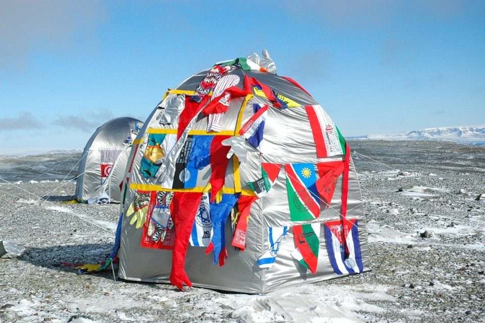 Lucy + Jorge Orta, <i>Antarctic Village - No Borders, Dome Dwelling</i>, 2007, ephemeral installation in Antarctica, 2007. 50 original dome dwellings, hand-stitched with nation flags, fragments of clothing, webbing, silkscreen print, dimensions variable. Courtesy of the artists. Photo: Thierry Bal