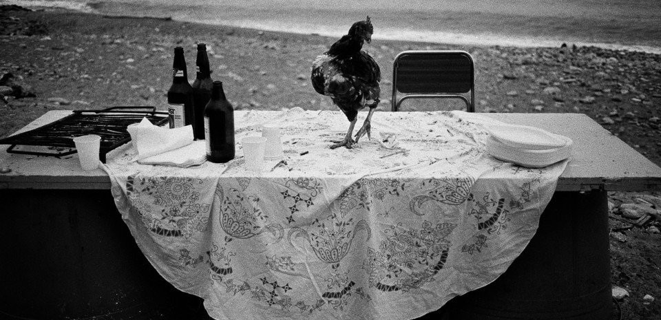 Letizia Battaglia, <i>Nella spiaggia dell’ Arenella la festa è finita</i>, Palermo, 1986. Courtesy Letizia Battaglia