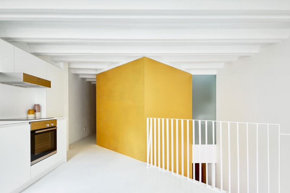 Raul Sanchez Architects renovated a duplex in Barcelona by adding twisted cubes