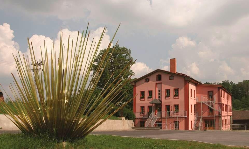 External view of the Ajeto glassworks in Lindava (co-owned by Lasvit) in a Bohemian countryside External view of the Ajeto glassworks in Lindava (co-owned by Lasvit) in a Bohemian countryside