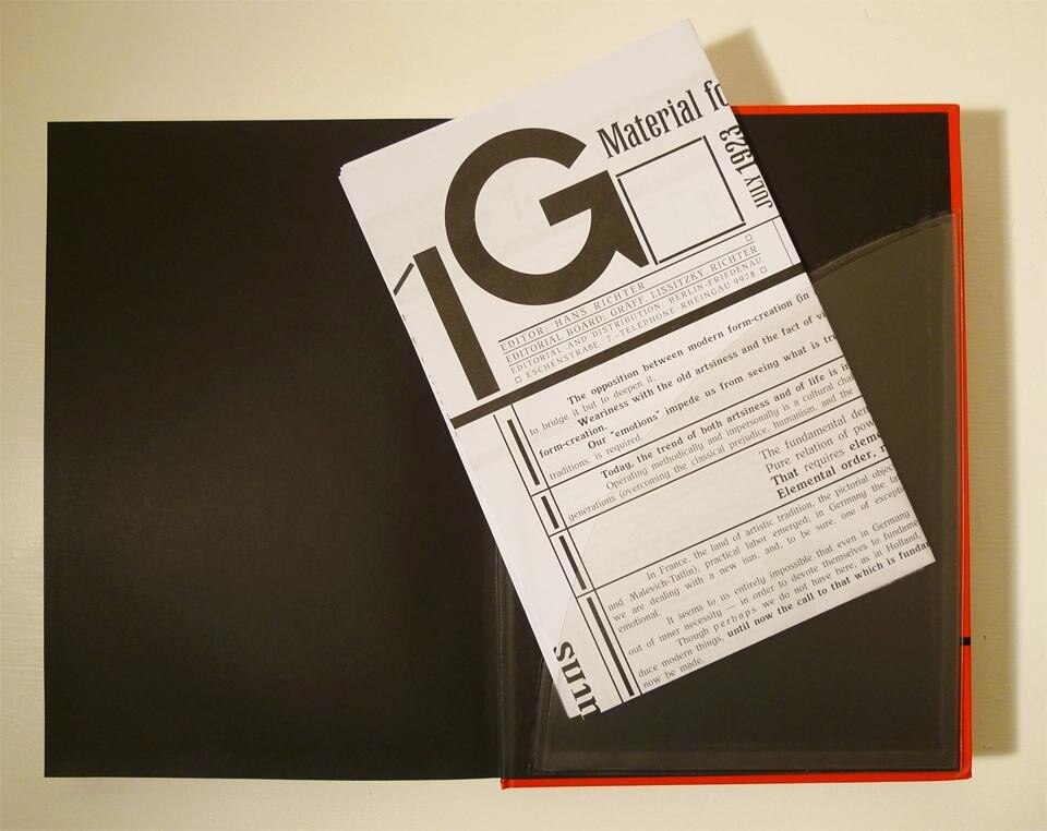 A sleeve on the inside back cover of <i>G: An Avant-Garde Journal of Art, Architecture, Design, and Film, 1923–1926</i> contains fold-out facsimile inserts. A sleeve on the inside back cover of <i>G: An Avant-Garde Journal of Art, Architecture, Design, and Film, 1923–1926</i> contains fold-out facsimile inserts.
